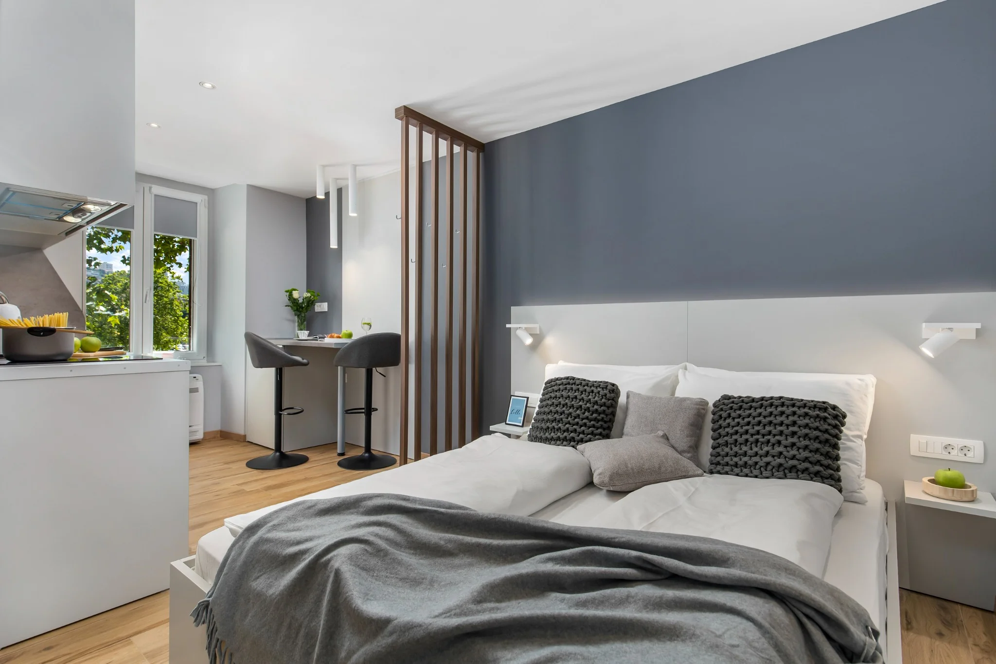 Apartment 2 wide studio view with bed and dining area